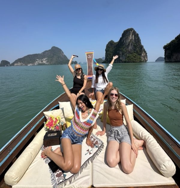 Group tour to James Bond Island in Thailand, cruising through limestone cliffs, turquoise waters, and hidden lagoons