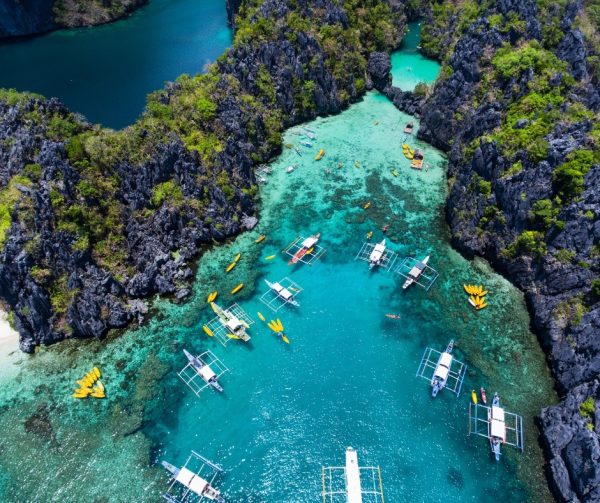 Divers exploring Barracuda Lake in Coron, Philippines with unique thermocline layers.