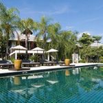Hotel in Pai, Thailand surrounded by mountains, greenery, and a peaceful natural setting