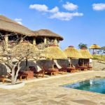 Luxury safari lodge in Tanzania with Gagago group trip overlooking the savannah during a Great Migration safari