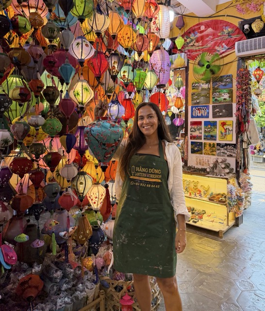 Traveler making traditional lantern in Hoi An Vietnam lantern workshop