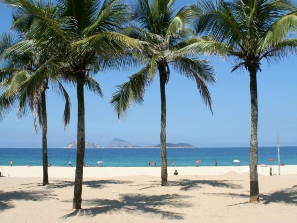 Beaches of Rio de Janeiro, Brazil including Copacabana and Ipanema with golden sand, ocean waves, and city skyline as part of a Brazil group travel itinerary.