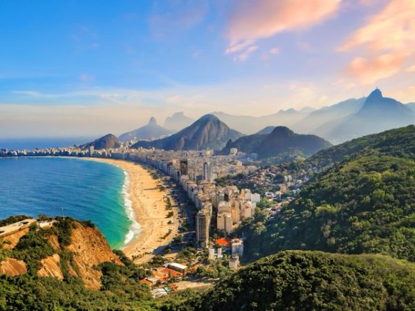 Scenic hike in Rio de Janeiro, Brazil with panoramic viewpoints overlooking beaches, mountains, and city skyline as part of a Brazil group travel itinerary.