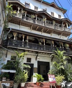 Exterior of the historic Emerson Spice boutique hotel with ornate wooden balconies in Stone Town, Zanzibar.