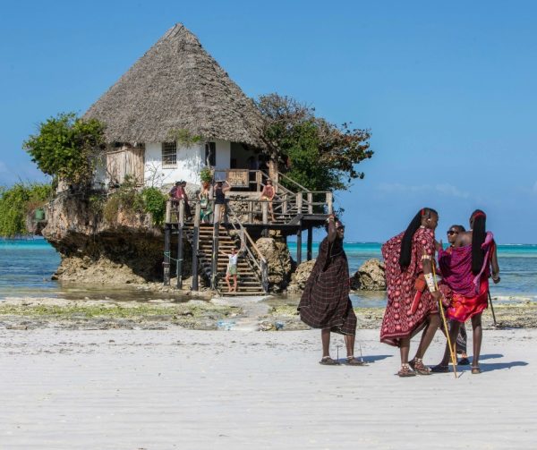 The Rock Restaurant on a coral outcrop in turquoise waters off Michamvi Beach during a Gagago Zanzibar tour.