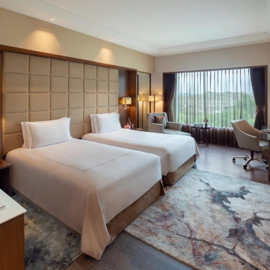 Elegant 5-star hotel suite in Agra offering a stunning view.