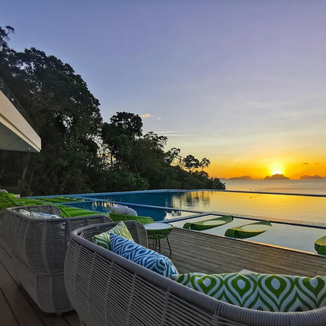 Lagoon-front hotel in El Nido, Palawan with limestone cliffs and emerald water, featured on a Gagago Philippines group trip.