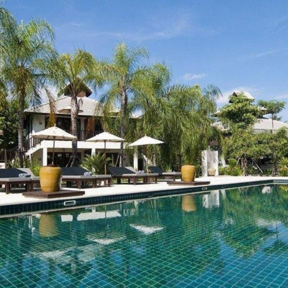 Hotel in Pai, Thailand surrounded by mountains, greenery, and a peaceful natural setting