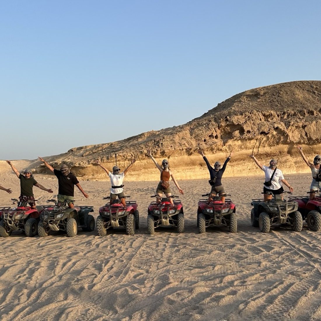 Riding a quad bike through the Egyptian desert, adventurous travel experience