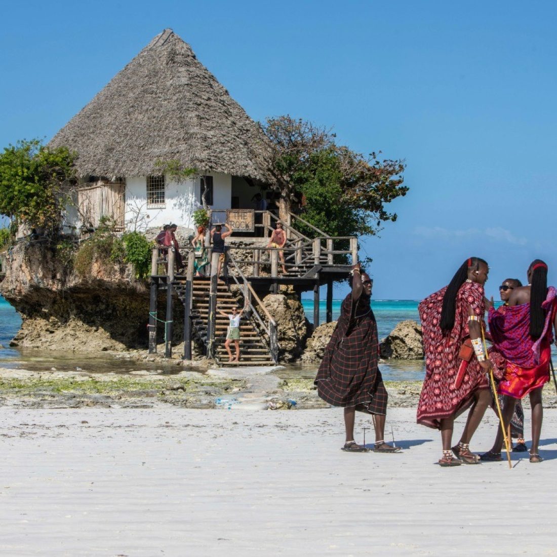 The Rock Restaurant on a coral outcrop in turquoise waters off Michamvi Beach during a Gagago Zanzibar tour.