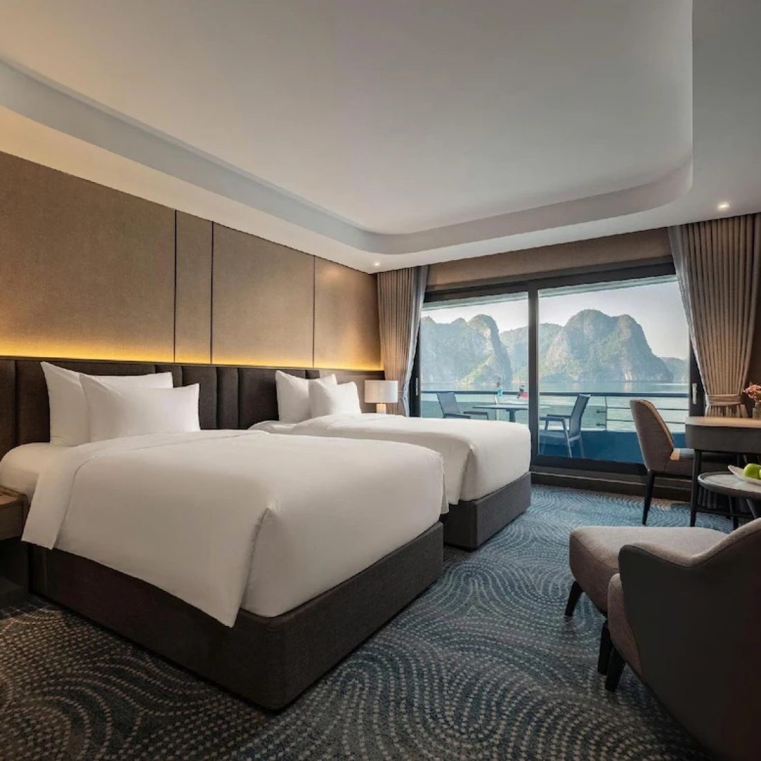 Luxury cruise cabin with balcony overlooking Halong Bay Vietnam